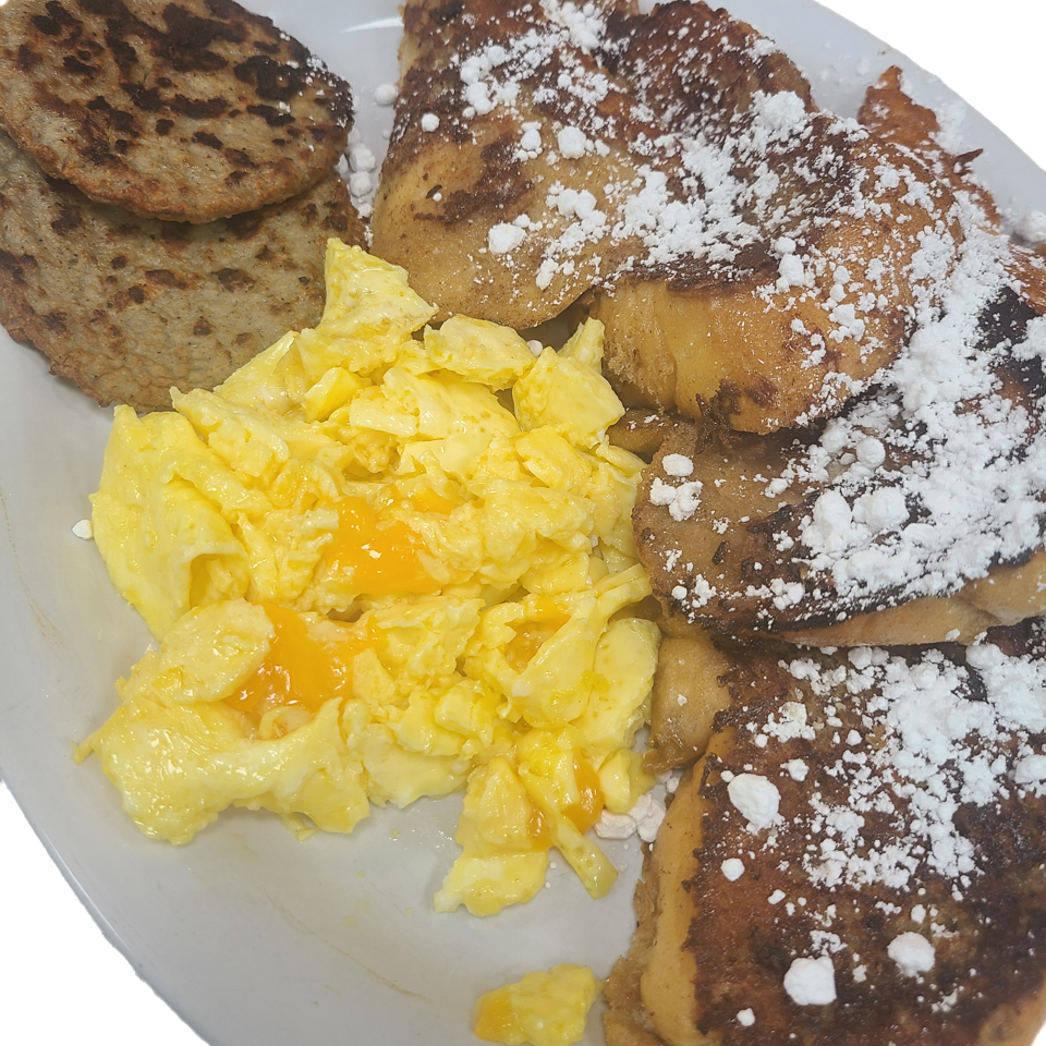French toast with scrambled eggs and sausage patties.